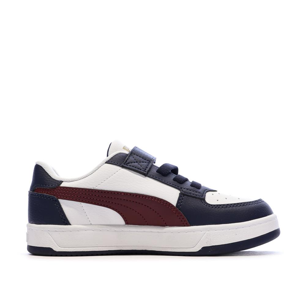 Zapatillas blancas y azul marino para niño de Puma Caven ver 2