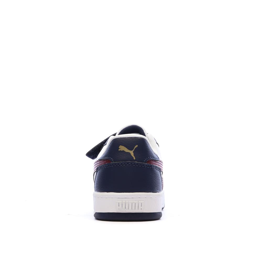 Zapatillas blancas y azul marino para niño de Puma Caven ver 3